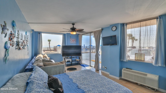 1233 S Atlantic Ave Unit 102, Daytona Beach, FL 32118 - tiled bedroom with multiple windows, ceiling fan, and access to exterior
