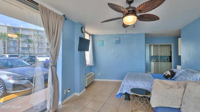1233 S Atlantic Ave Unit 102, Daytona Beach, FL 32118 - tiled bedroom featuring baseboards and a ceiling fan