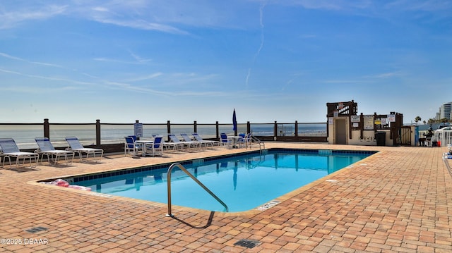 1233 S Atlantic Ave Unit 102, Daytona Beach, FL 32118 - community pool featuring a patio and a water view