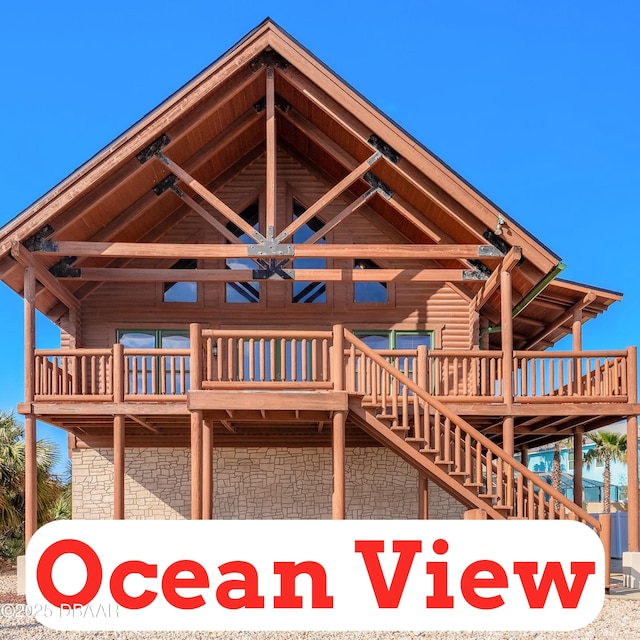 109 Avalon Dr, Ormond Beach, FL 32176 - back of house featuring stairway and log siding