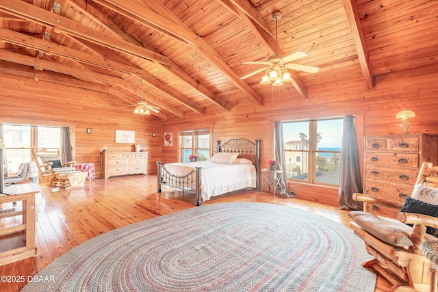 109 Avalon Dr, Ormond Beach, FL 32176 - bedroom with vaulted ceiling with beams, wood walls, wood ceiling, and hardwood / wood-style floors