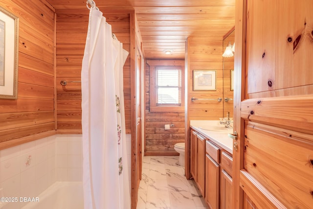 109 Avalon Dr, Ormond Beach, FL 32176 - full bathroom with marble finish floor, wood walls, and toilet