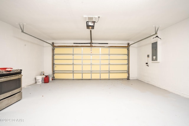 garage with a garage door opener and electric panel