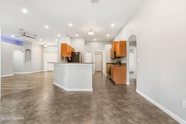 kitchen with ceiling fan, sink, and appliances with stainless steel finishes