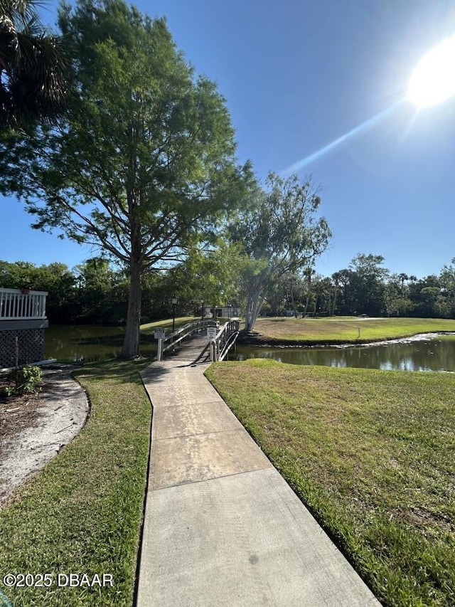 539 Lake Bridge Dr, Ormond Beach, FL 32174 - view of community featuring a water view and a yard