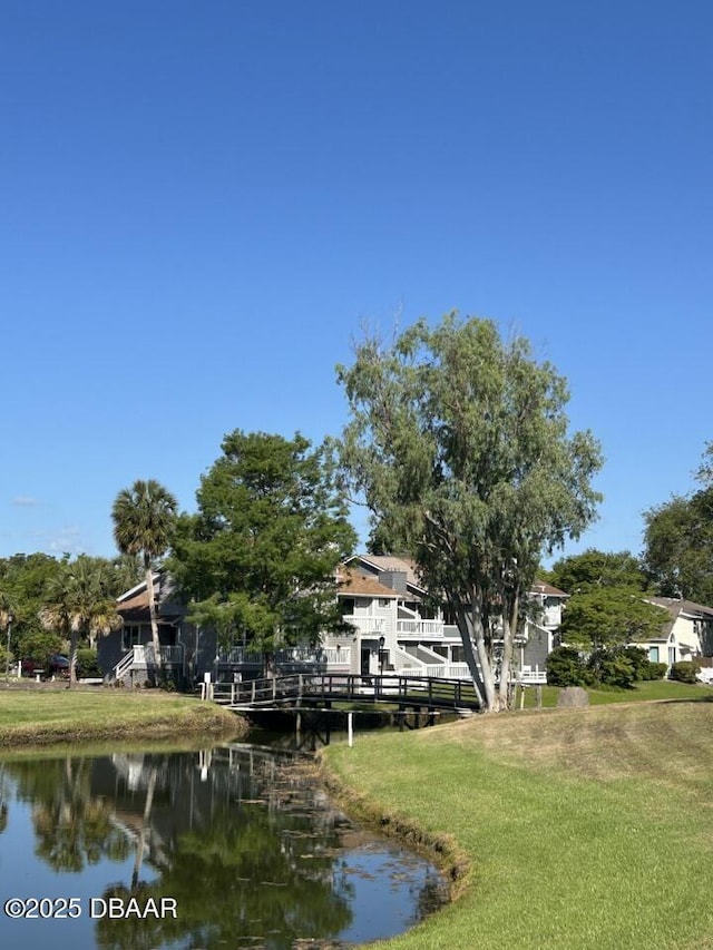 539 Lake Bridge Dr, Ormond Beach, FL 32174 - dock with a water view and a yard