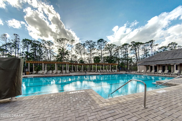 view of swimming pool featuring a patio area