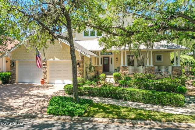 craftsman-style house with a garage and covered porch