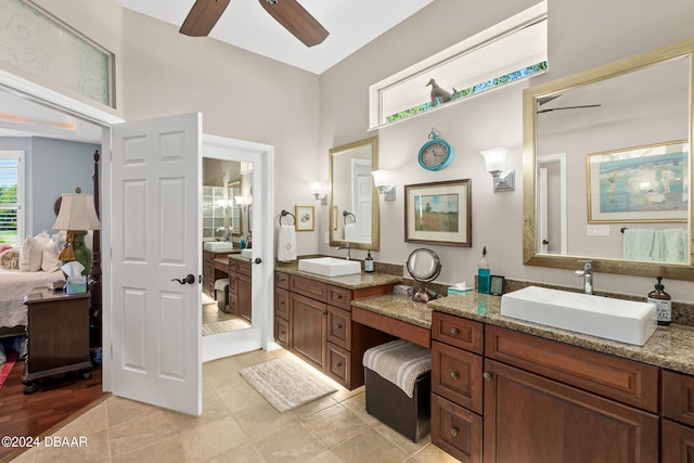 bathroom featuring wood-type flooring, ceiling fan, and vanity