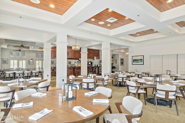 dining space featuring decorative columns, coffered ceiling, wooden ceiling, and ceiling fan