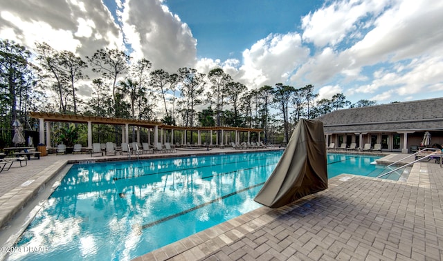 view of swimming pool with a patio area