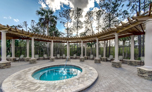 view of pool featuring a community hot tub, a pergola, and a patio