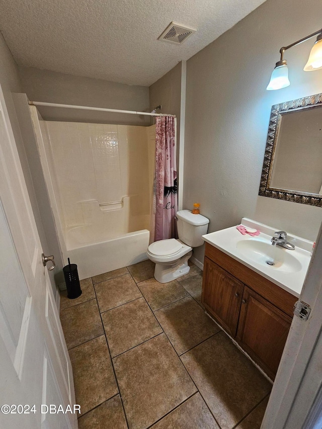 full bathroom featuring toilet, tile patterned flooring, a textured ceiling, vanity, and shower / bathtub combination with curtain