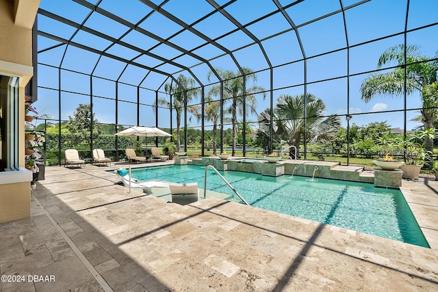 view of swimming pool with glass enclosure, a patio area, and pool water feature