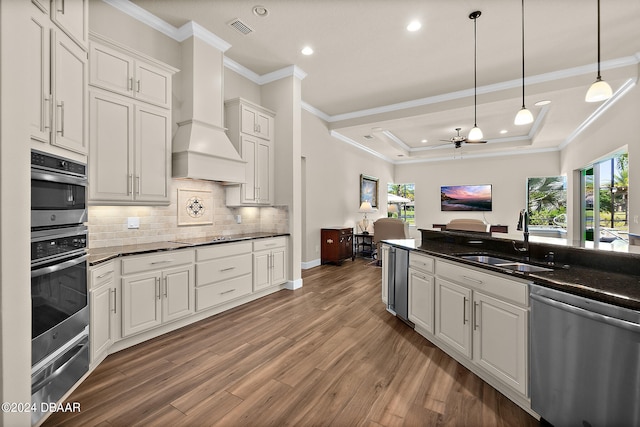 kitchen featuring white cabinets, plenty of natural light, sink, and black appliances