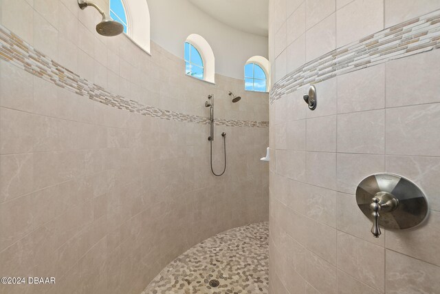 bathroom with a tile shower