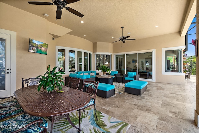 view of patio with ceiling fan, french doors, and an outdoor living space