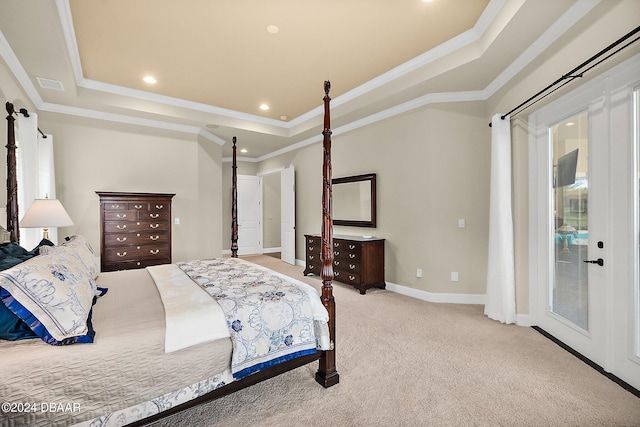 carpeted bedroom with access to exterior, crown molding, and a tray ceiling