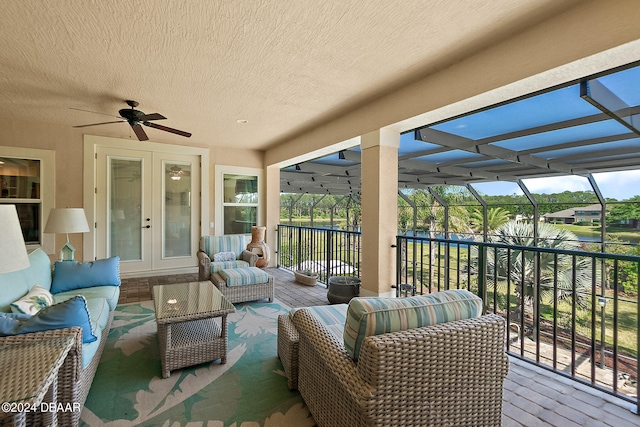 sunroom with french doors and ceiling fan