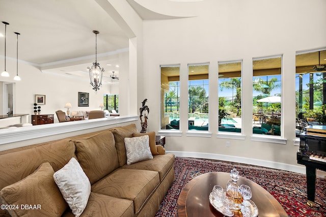 living room with a wealth of natural light and an inviting chandelier