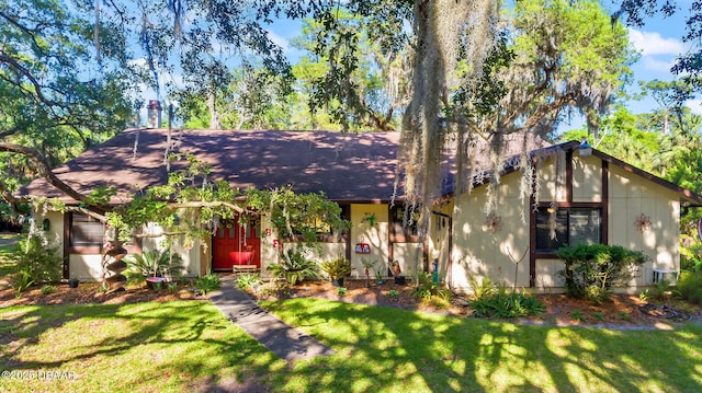 61 Village Dr, Ormond Beach, FL 32174 - single story home with roof with shingles and a front yard