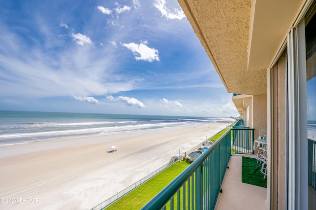 balcony with a view of the beach and a water view