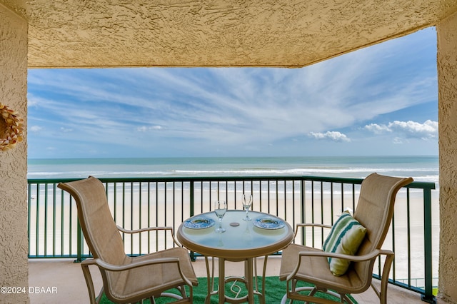 balcony with a view of the beach and a water view