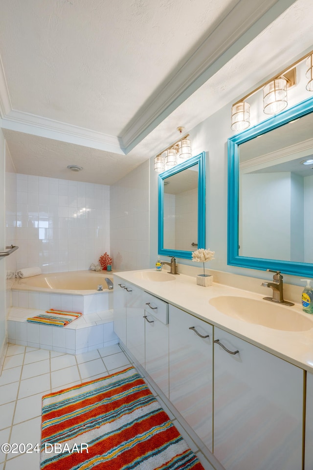 bathroom featuring tile patterned flooring, a relaxing tiled tub, a textured ceiling, vanity, and crown molding