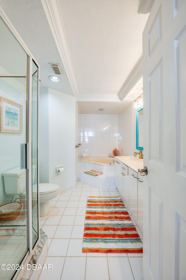 full bathroom featuring tile patterned floors, ornamental molding, separate shower and tub, a textured ceiling, and toilet