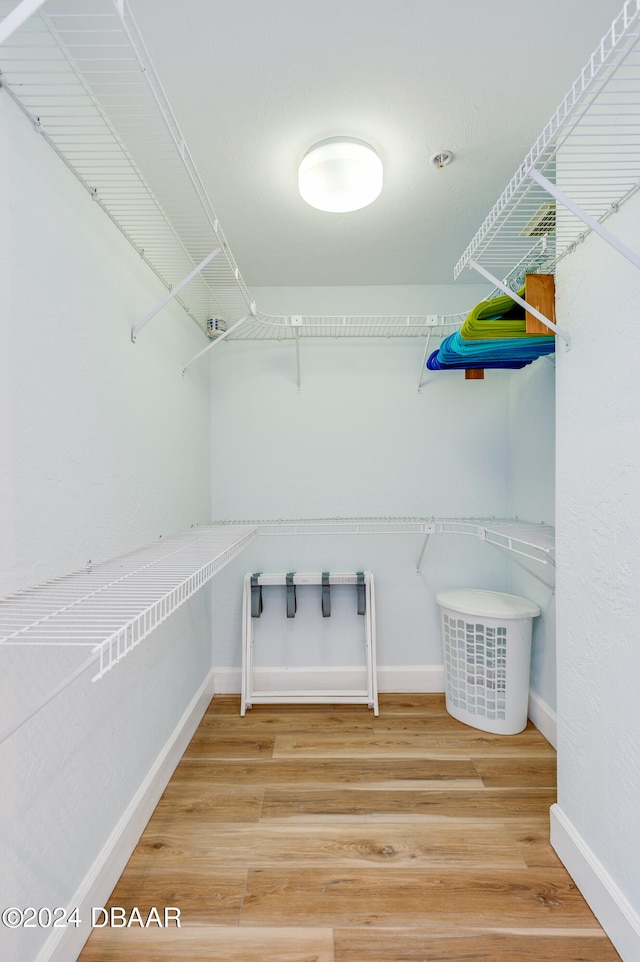 walk in closet featuring wood-type flooring