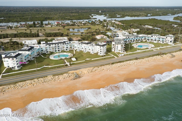 aerial view with a view of the beach and a water view