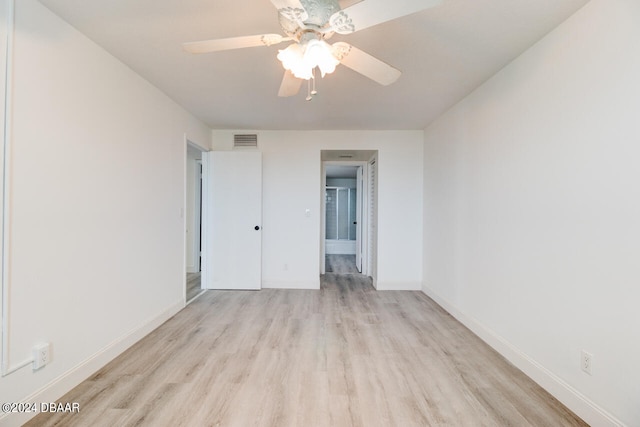 spare room featuring light hardwood / wood-style flooring and ceiling fan