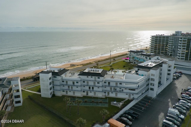 bird's eye view featuring a view of the beach and a water view