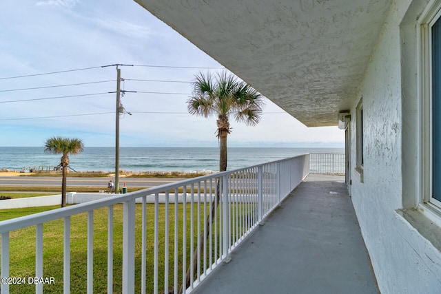 balcony featuring a water view