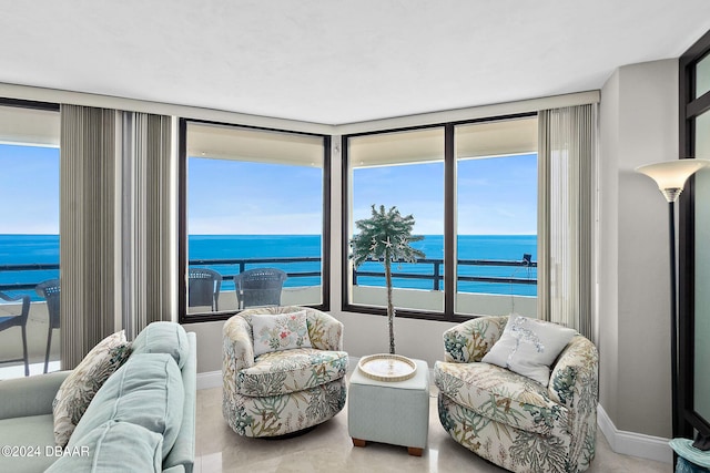 living room with a wealth of natural light and a water view