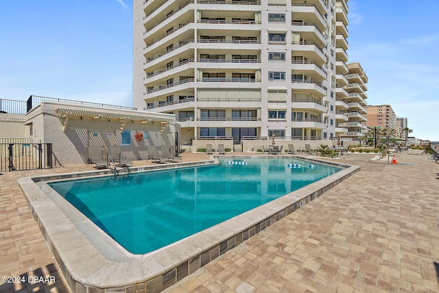 view of swimming pool with a patio area