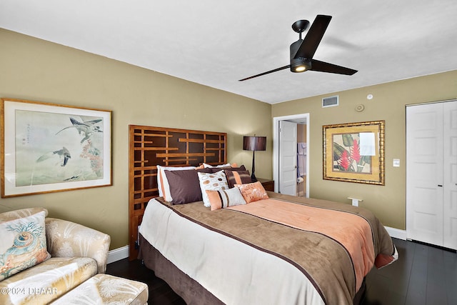 bedroom with ceiling fan and dark hardwood / wood-style flooring