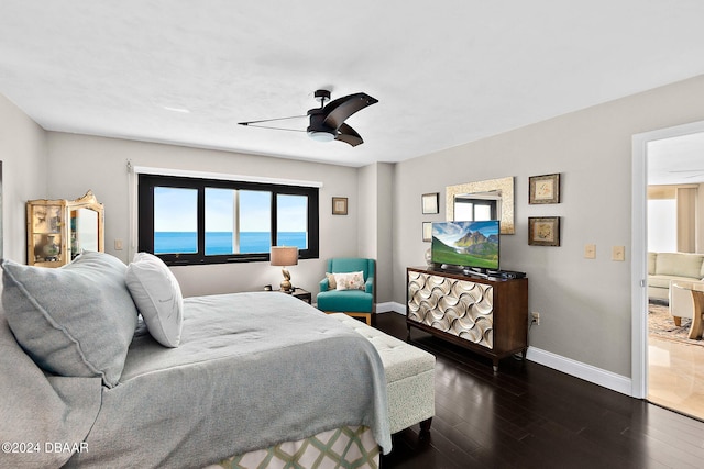 bedroom featuring dark hardwood / wood-style floors and ceiling fan