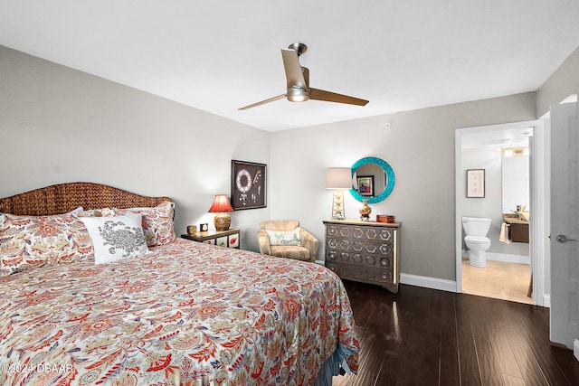 bedroom featuring dark wood-type flooring, ceiling fan, and ensuite bath