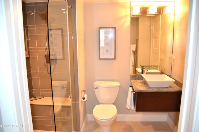 bathroom with walk in shower, tile patterned floors, vanity, and toilet