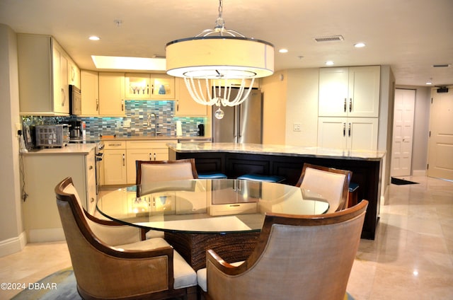 dining space featuring sink