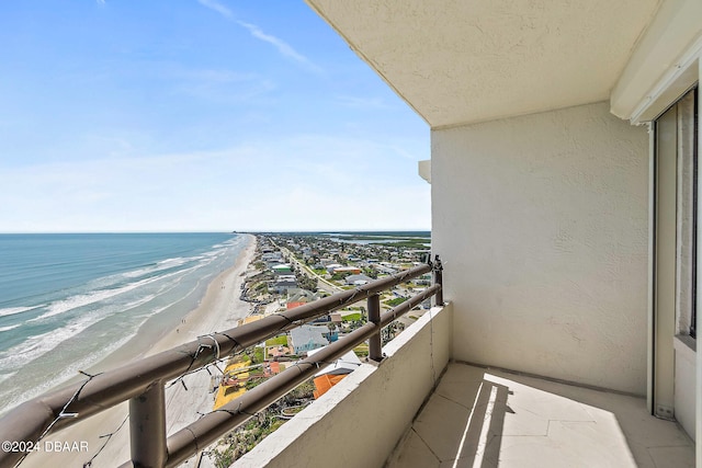 balcony with a view of the beach and a water view