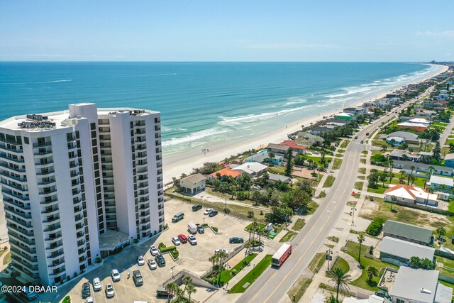 bird's eye view with a beach view and a water view