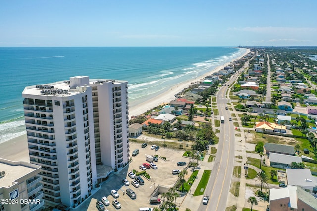 bird's eye view with a beach view and a water view