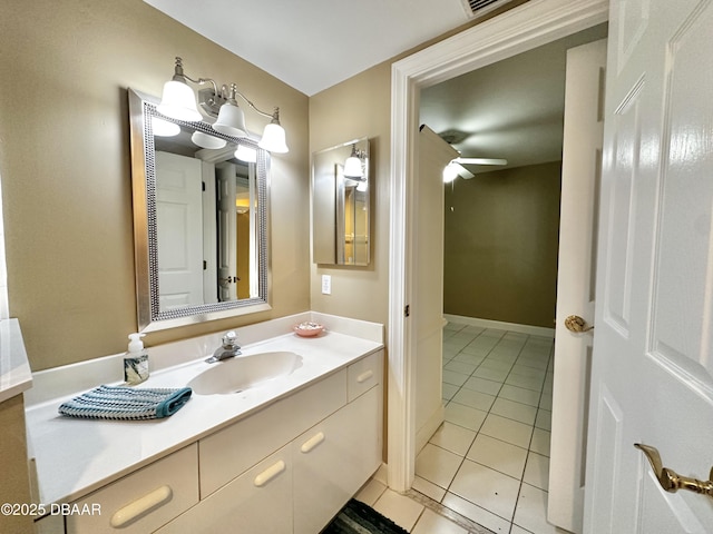 bathroom with tile patterned flooring, vanity, and a ceiling fan