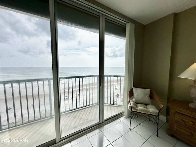 balcony with view of water and beach