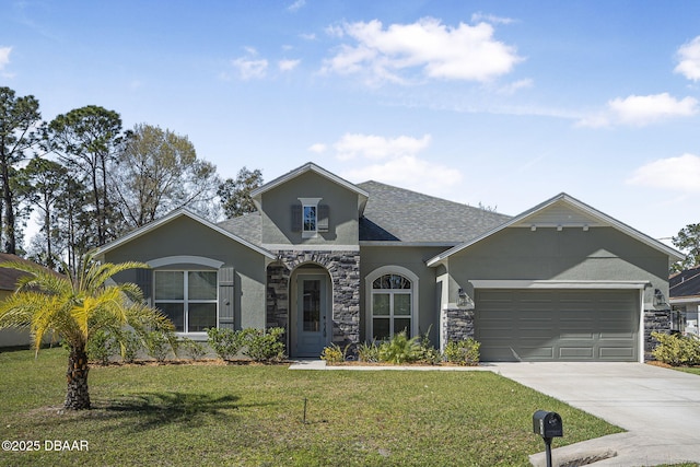 single story home with stucco siding, concrete driveway, an attached garage, a front yard, and stone siding