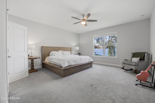 carpeted bedroom with a ceiling fan and baseboards