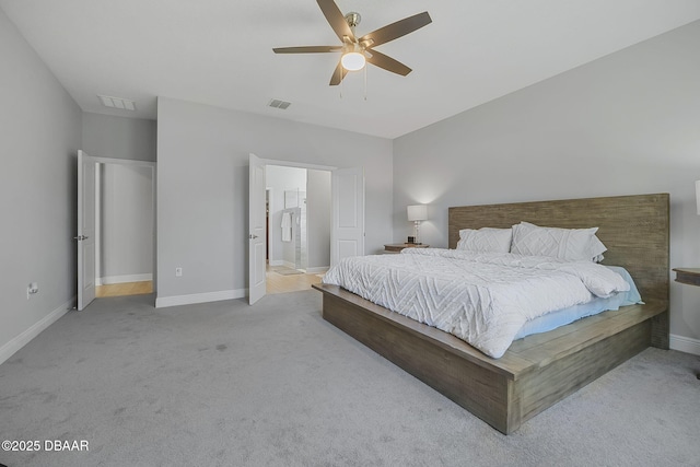 bedroom with carpet, visible vents, and baseboards