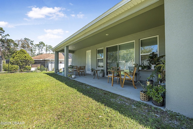 exterior space with a patio area and fence